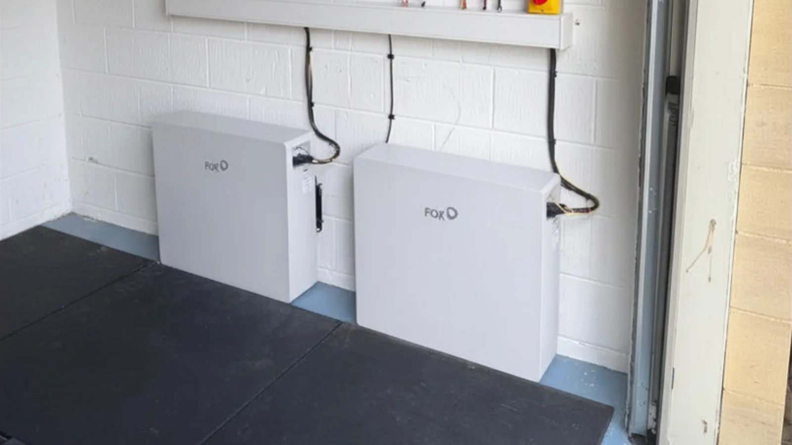 Two Fox ESS home battery units installed in a garage