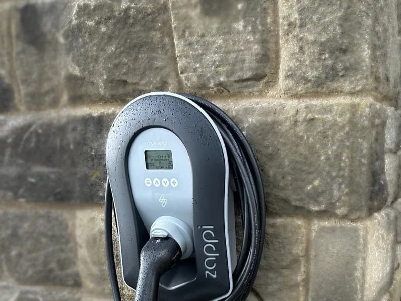 myenergi Zappi EV charger installed on a Yorkshire stone wall